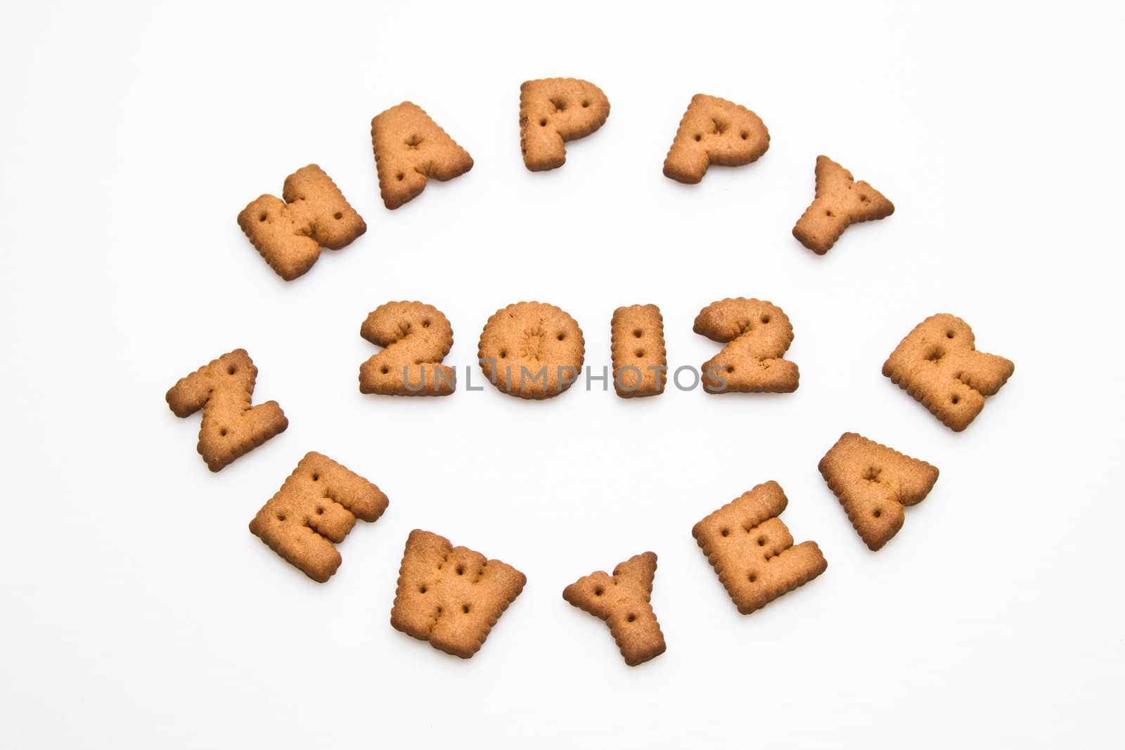 Happy New Year  2012 greeting words made by brown biscuits in center of white surface in landscape orientation for background use