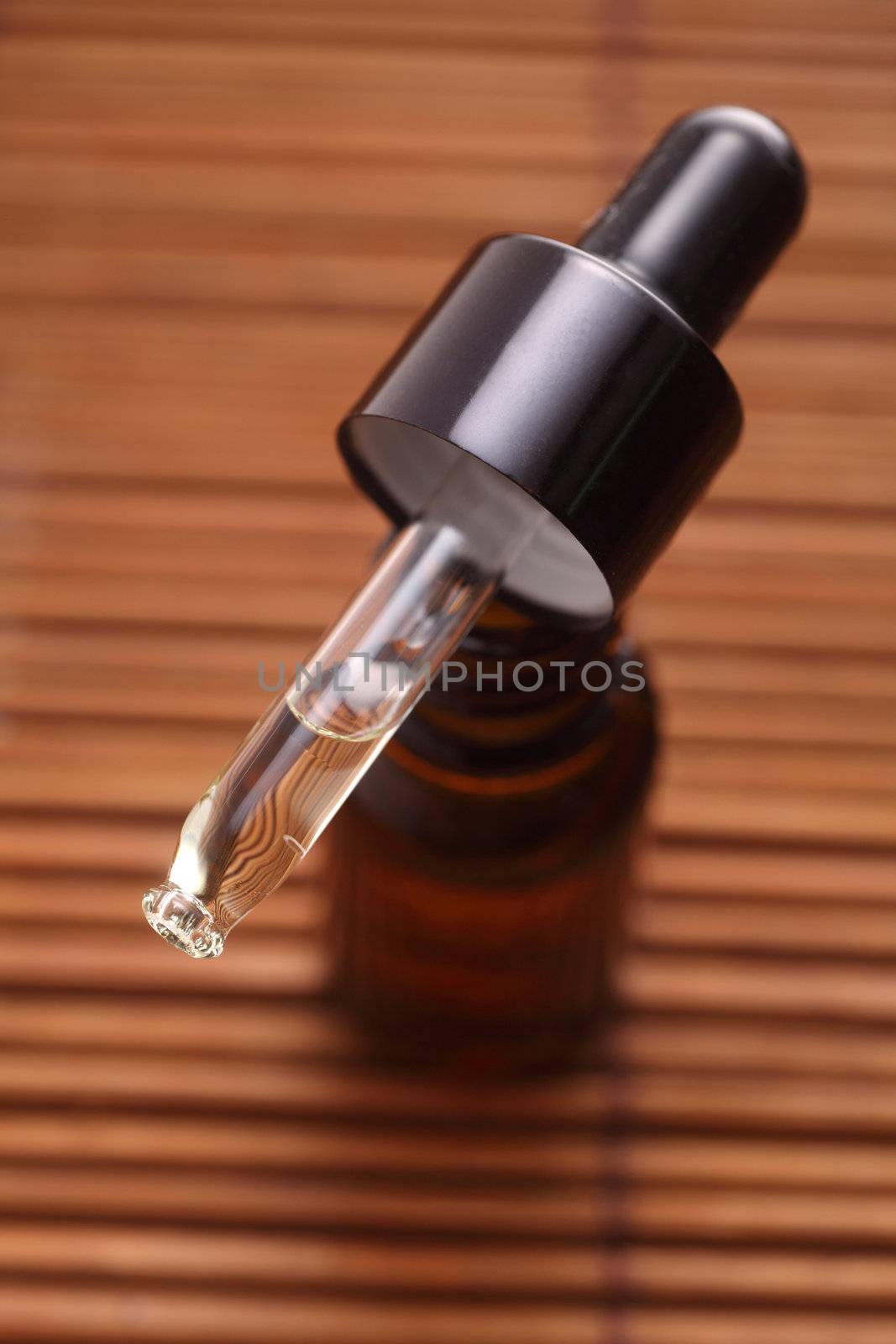 dropper on top of the bottle of massage oil