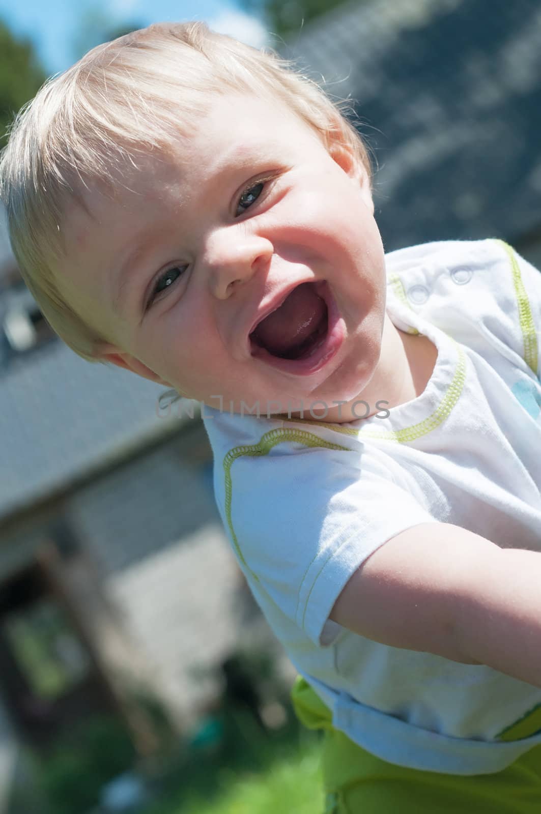 Happy baby boy watching on you, outdoor