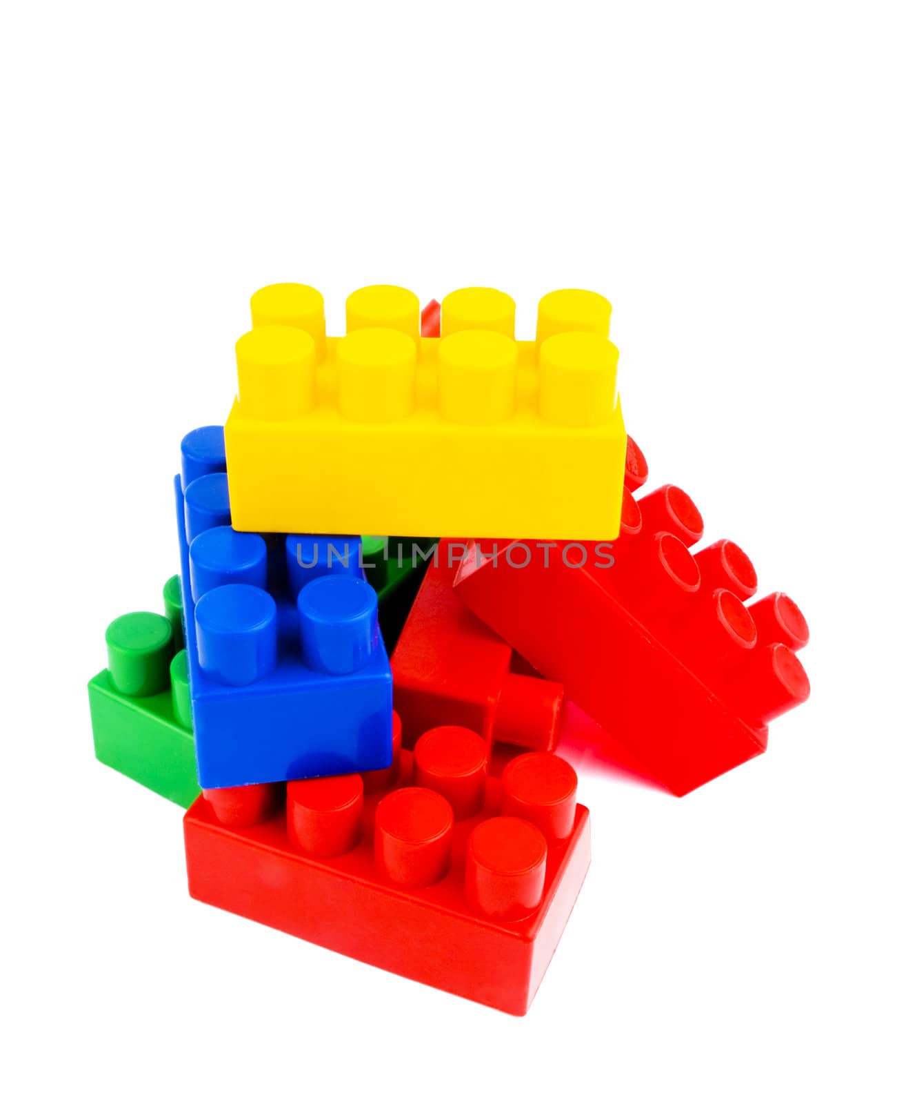 Colourful plastic bricks on white background