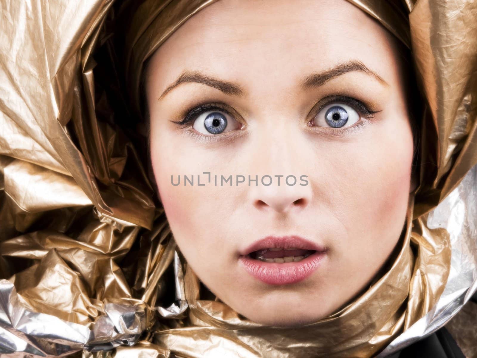 Beutiful woman face in gold foil
