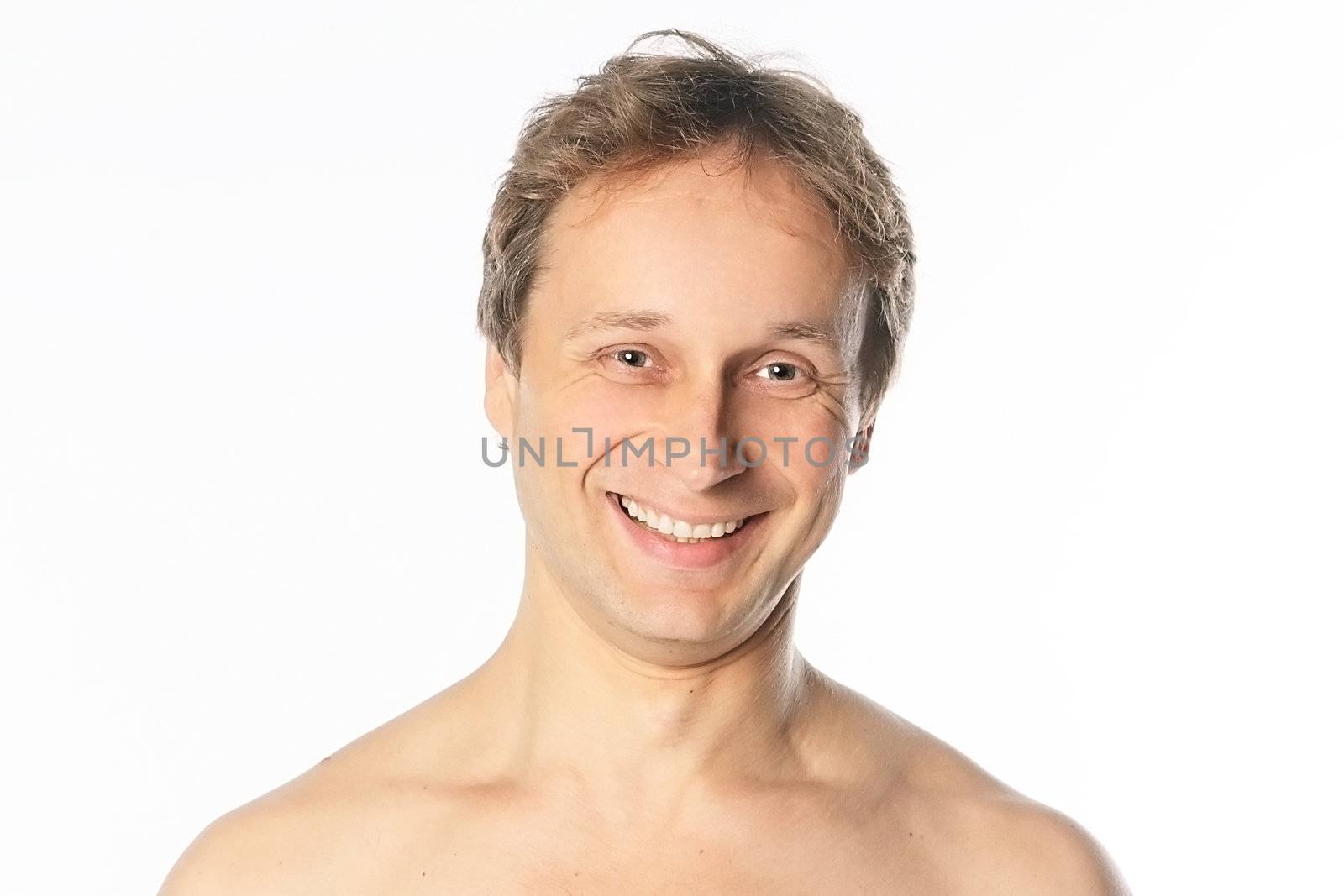 Portrait of a happy middle age man with naked shoulders