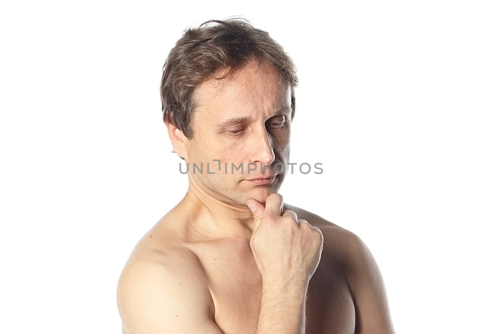 Portrait of a pensive middle age man with naked shoulder