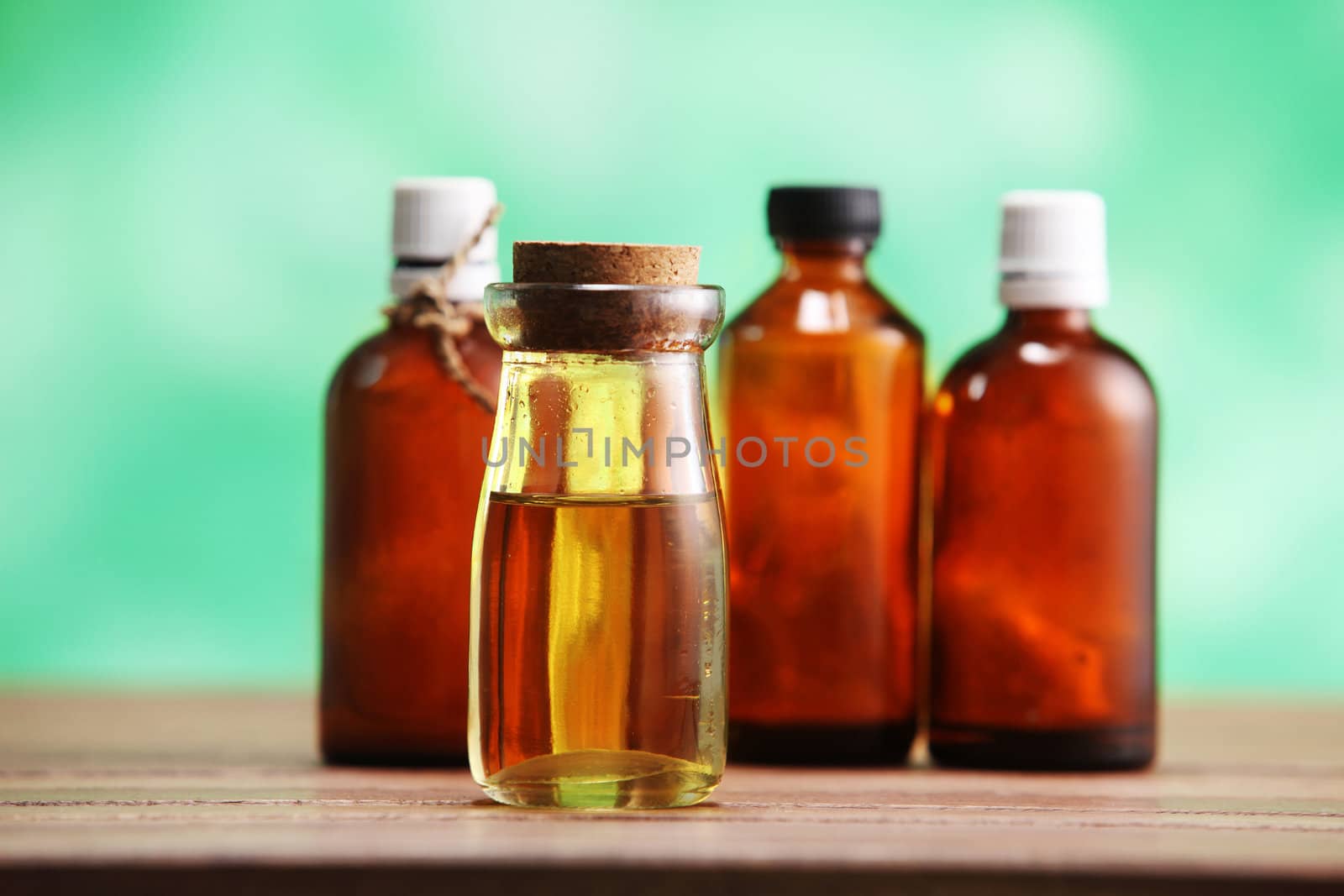 group of the massage oil on the wooden table