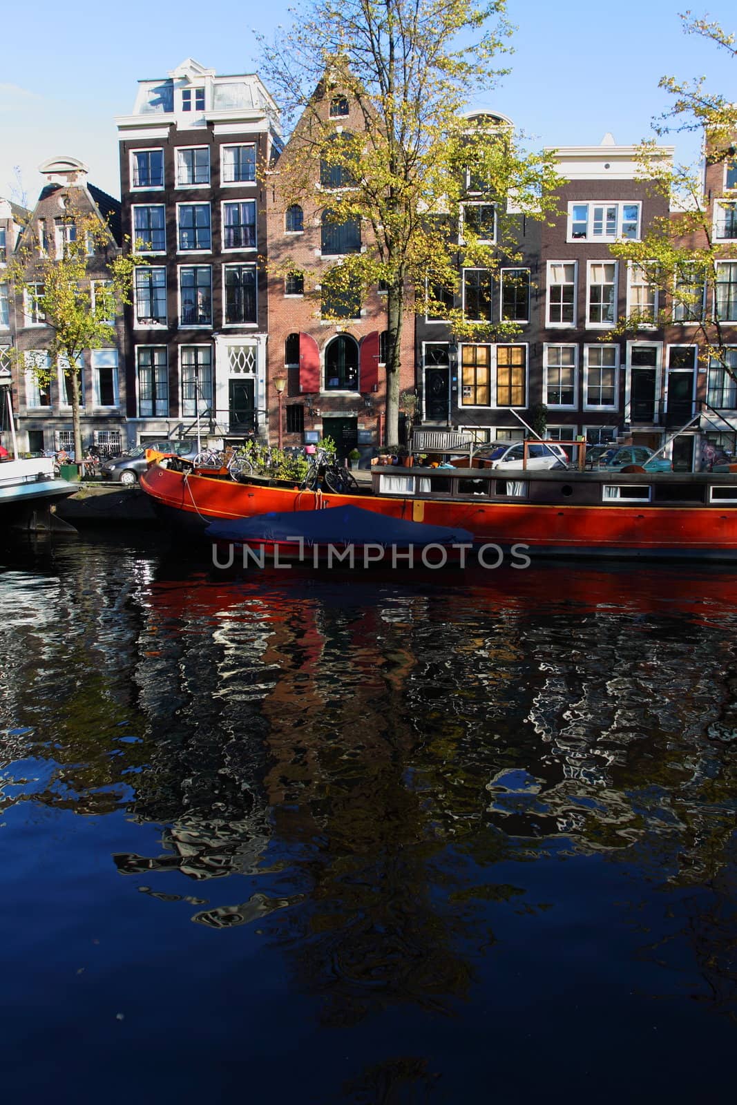 Quiet Amsterdam canal with house boats  by mariusz_prusaczyk