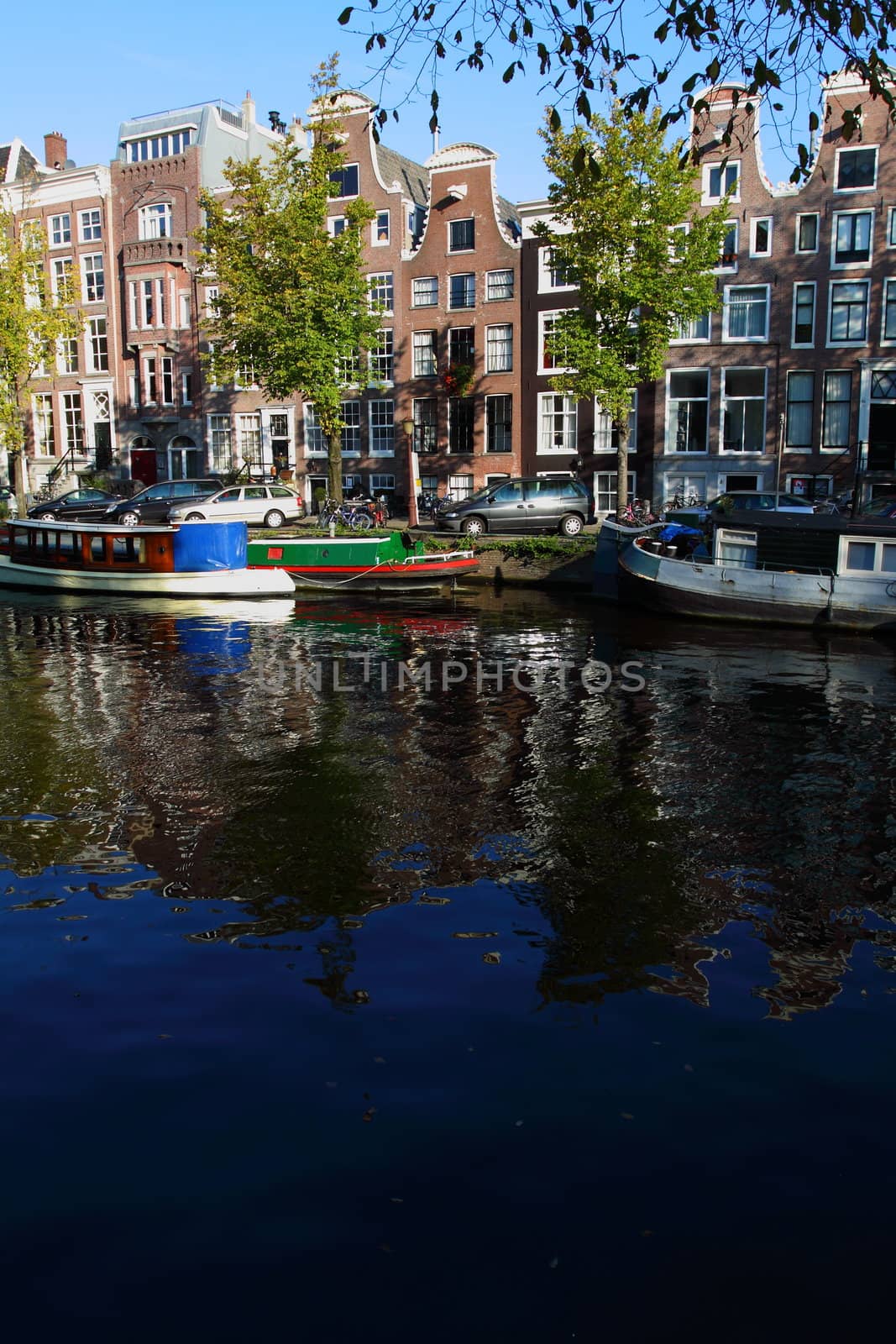 Quiet Amsterdam canal with house boats 