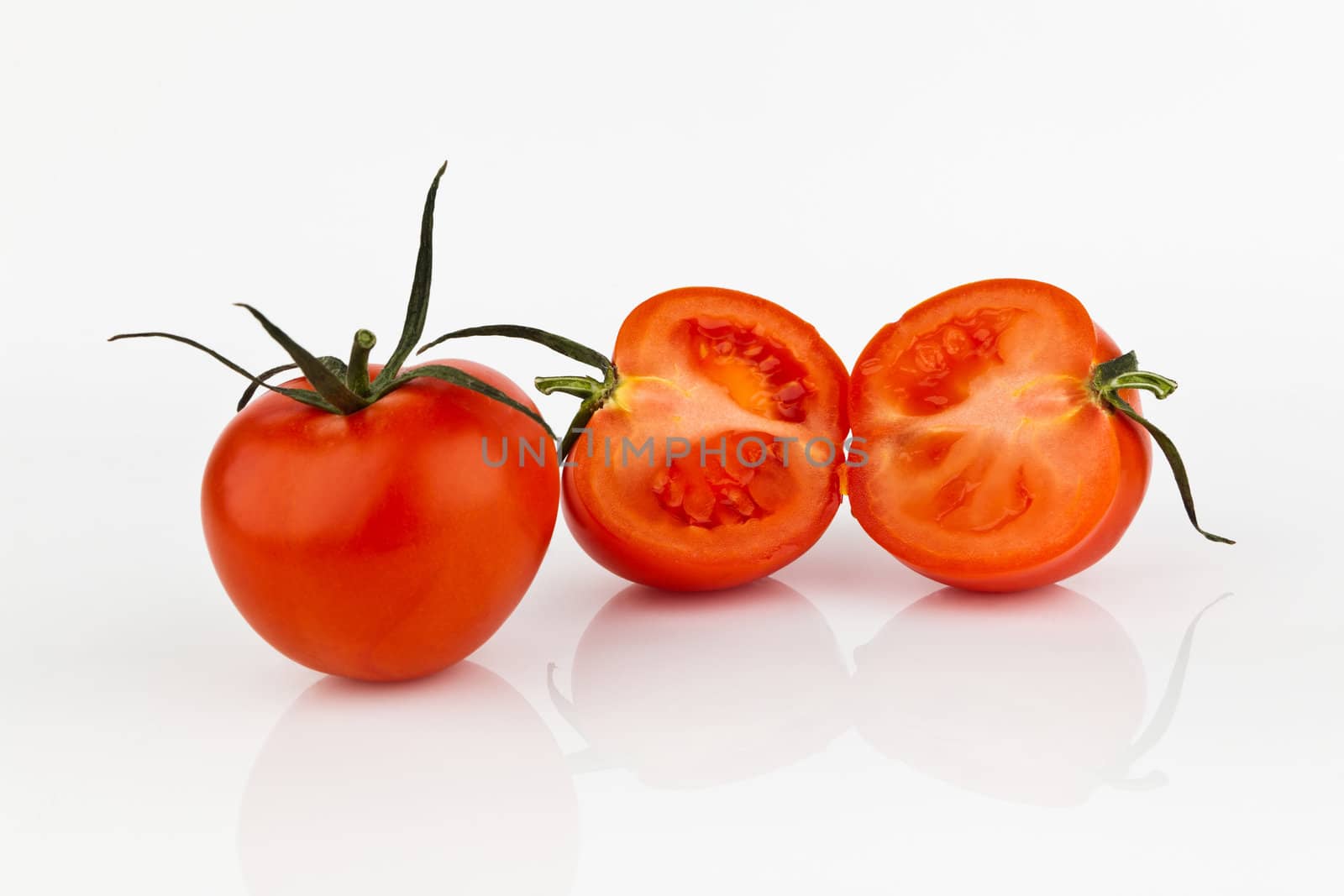 fresh tomatoes with shadow isolated on white.