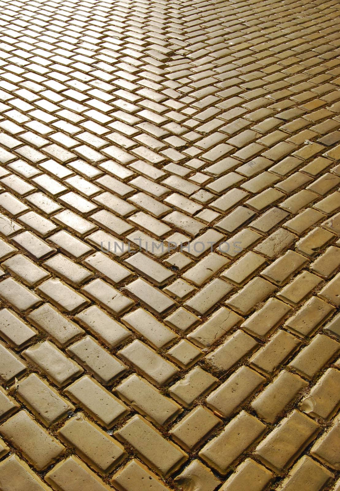 Yellow ceramic town pavement close-up in perspective