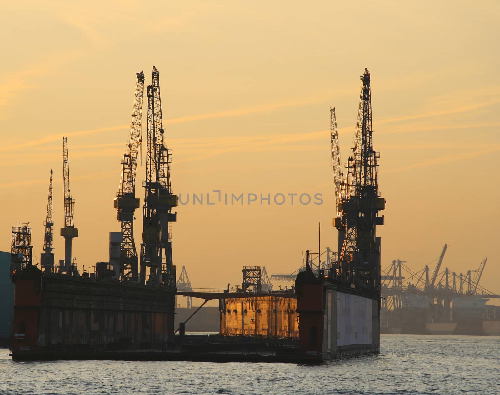 Empty floating dock at sunset in the harbour of Hamburg, Germany. Amazing light. February 2006.