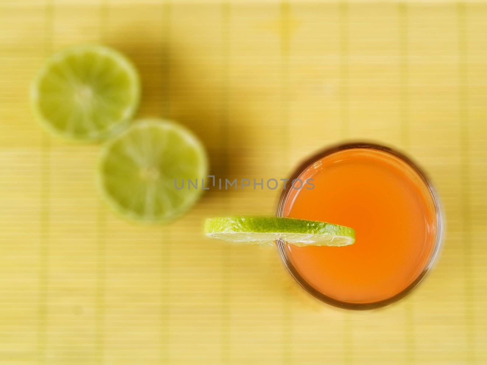 Orange juice with a lime slice