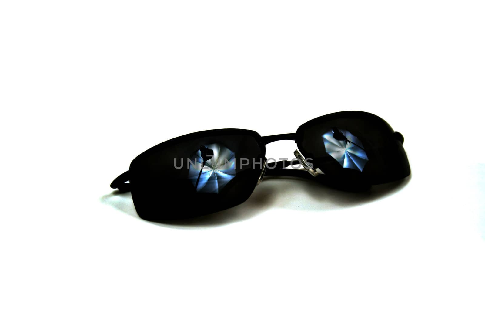 Sunglasses with Studio Lighting was created to  show a photographer's studio lights reflection in the lenses of the sunglasses when adjusted to the proper orientation. This is an abstract representation.

