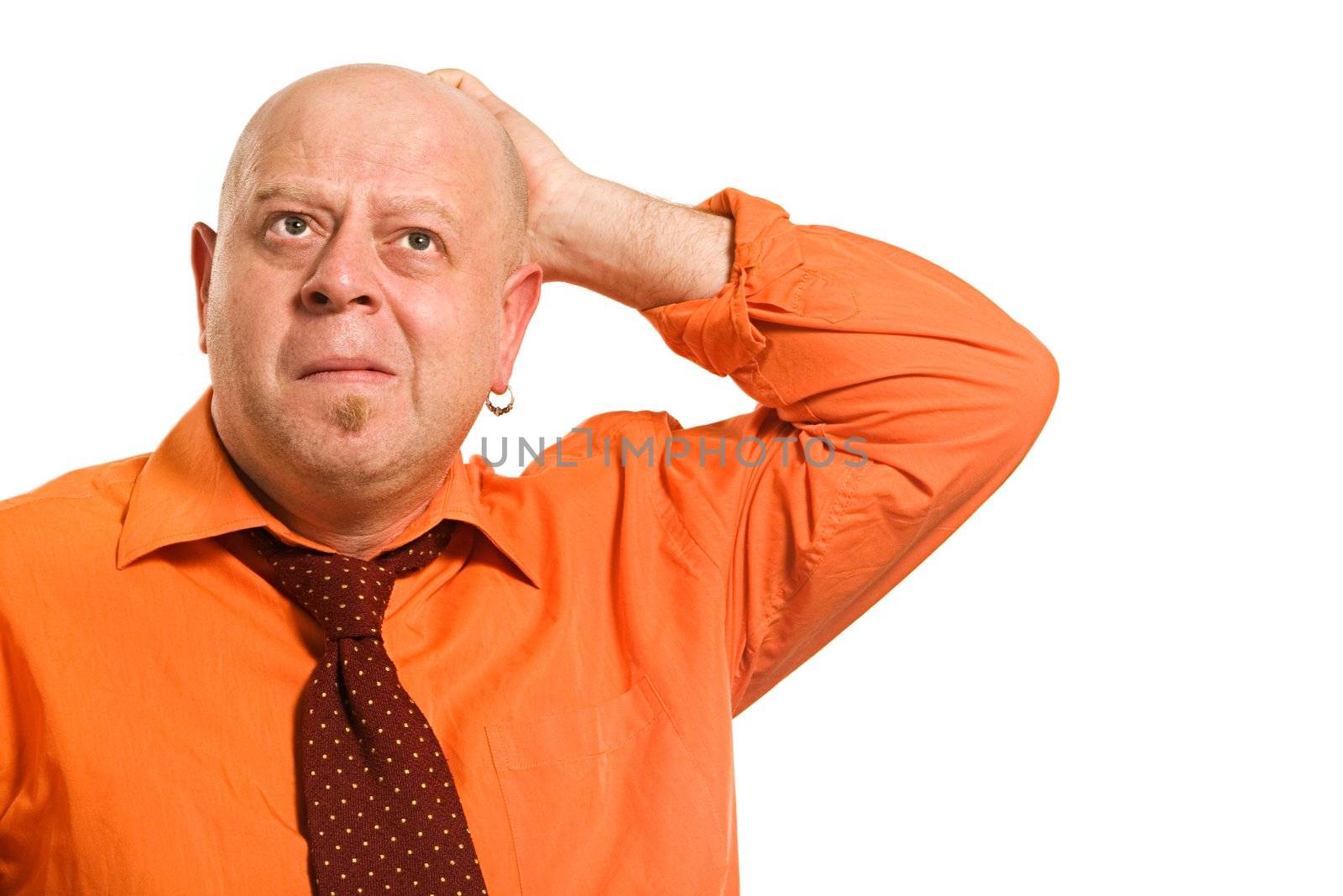 Cheerful comical bald man in an orange shirt and a red tie on a white background 
