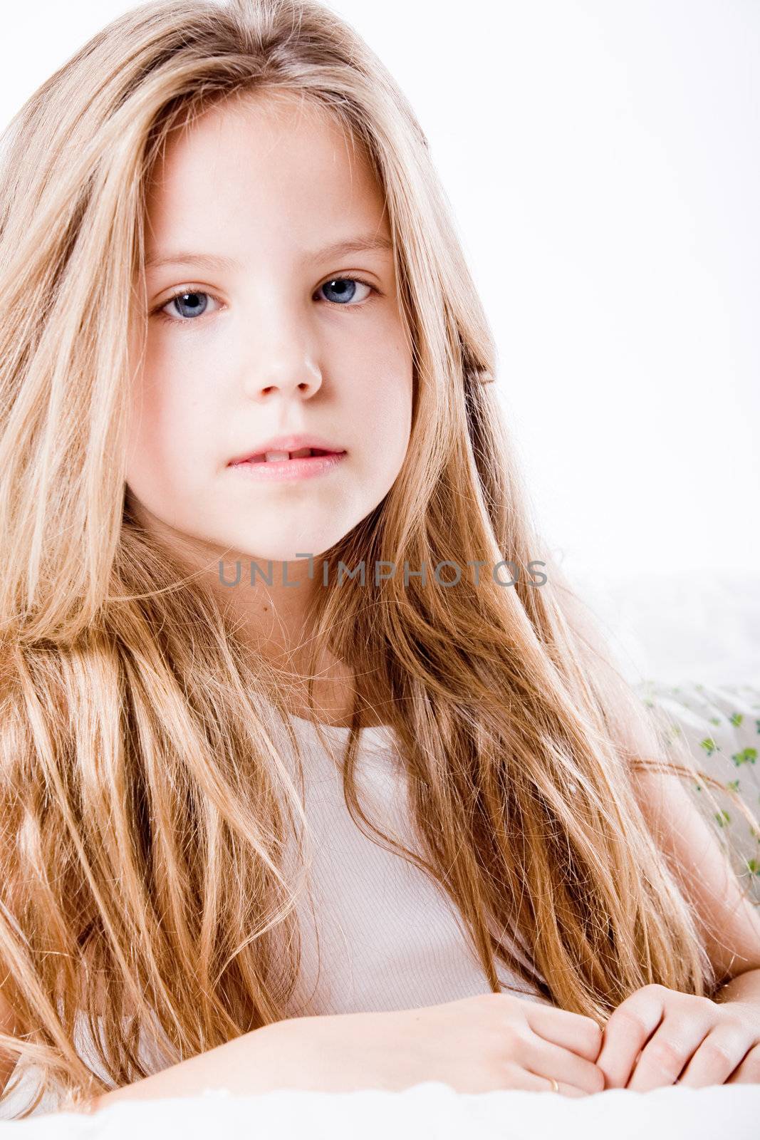 A portrait of a young cute girl in the studio