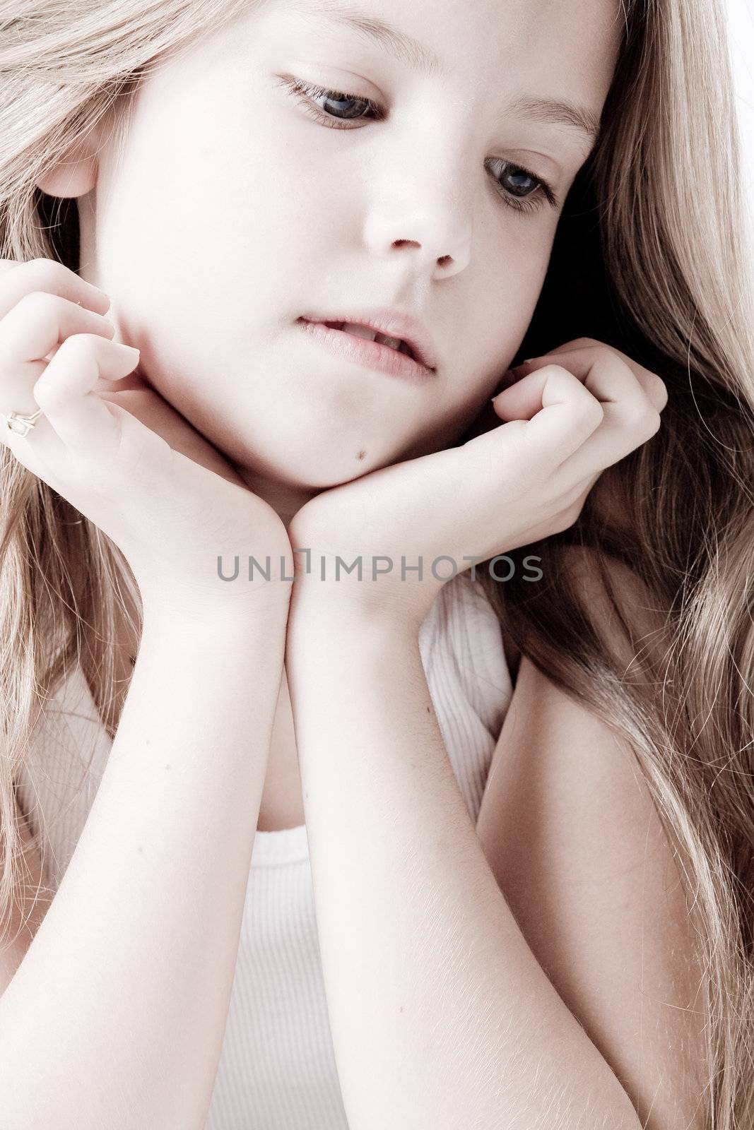 A portrait of a young cute girl in the studio