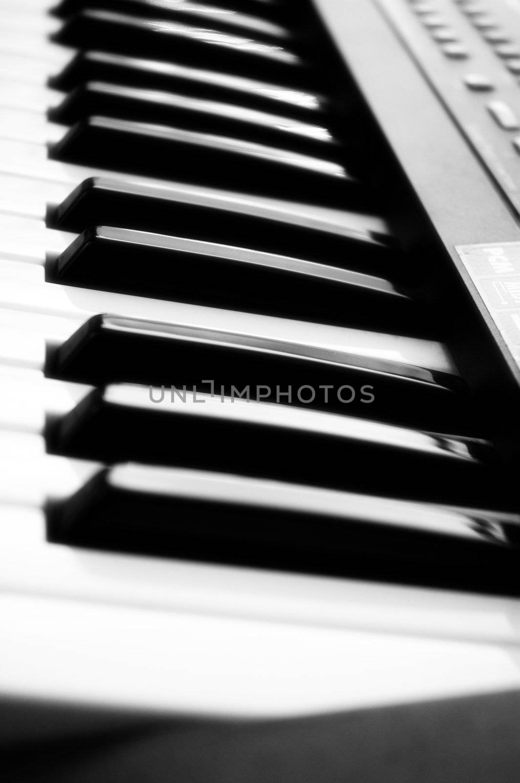 Close-up of an electronic piano keyboard with soft focus