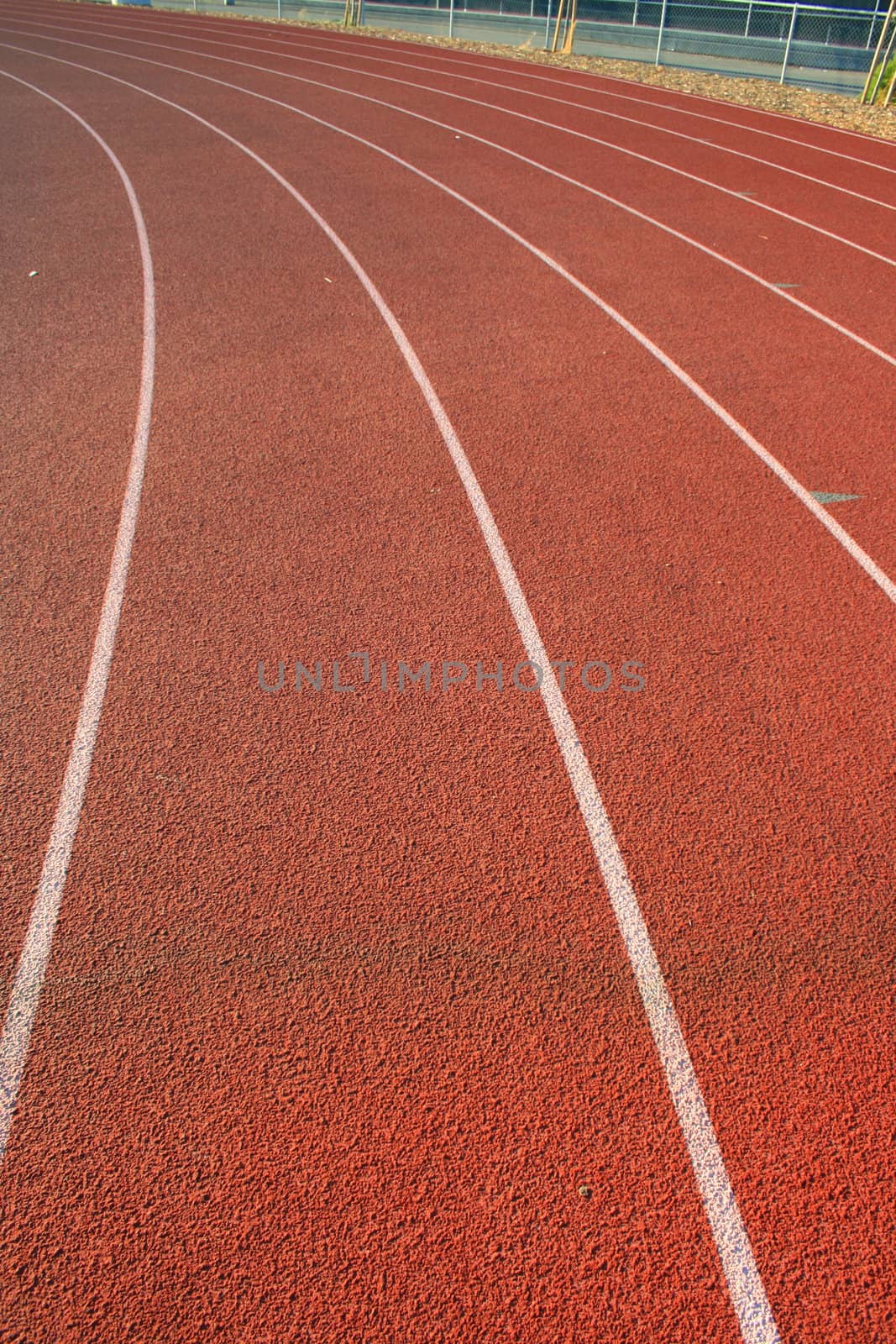 Close up of a running track on sunny day.
