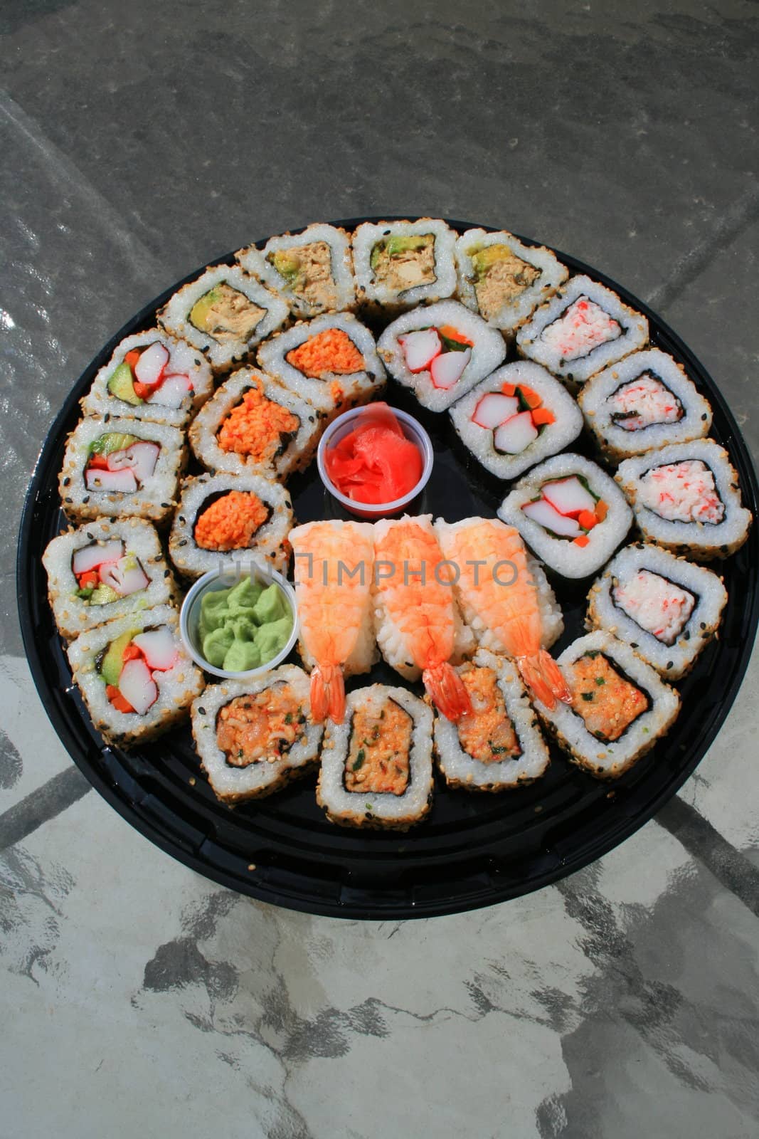 Close up of sushi assortment on a platter.
