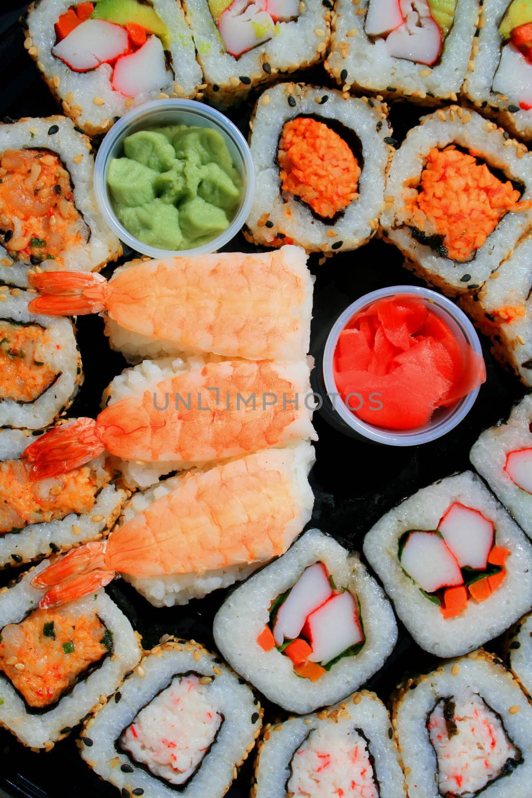 Close up of sushi assortment on a platter.
