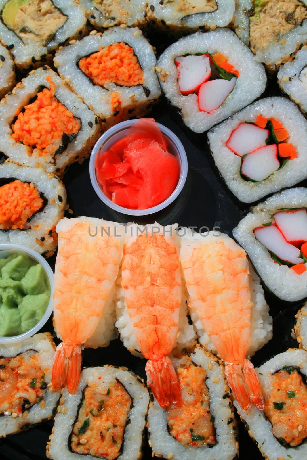 Close up of sushi assortment on a platter.
