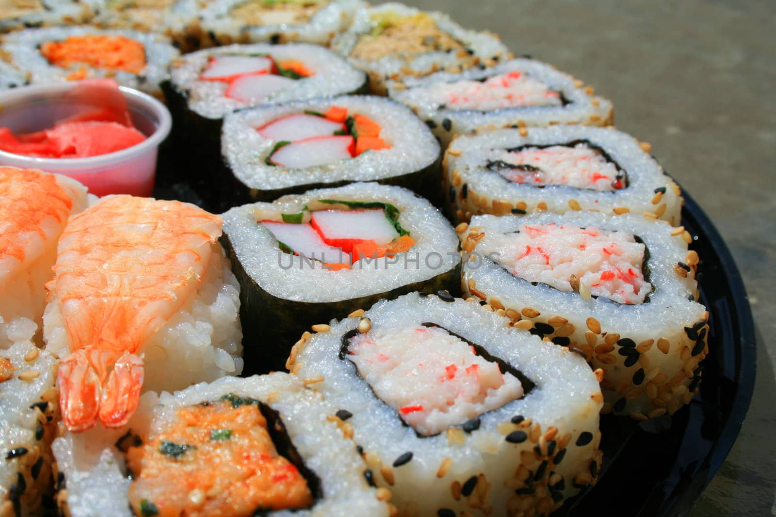 Close up of sushi assortment on a platter.
