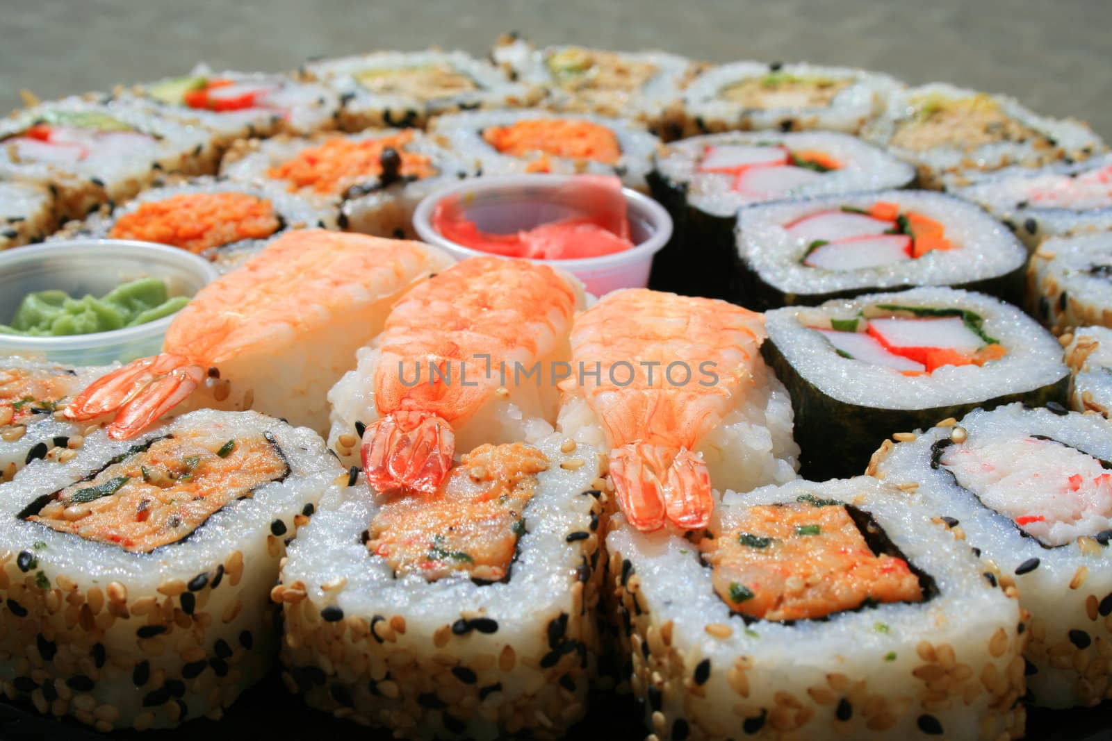 Close up of sushi assortment on a platter.
