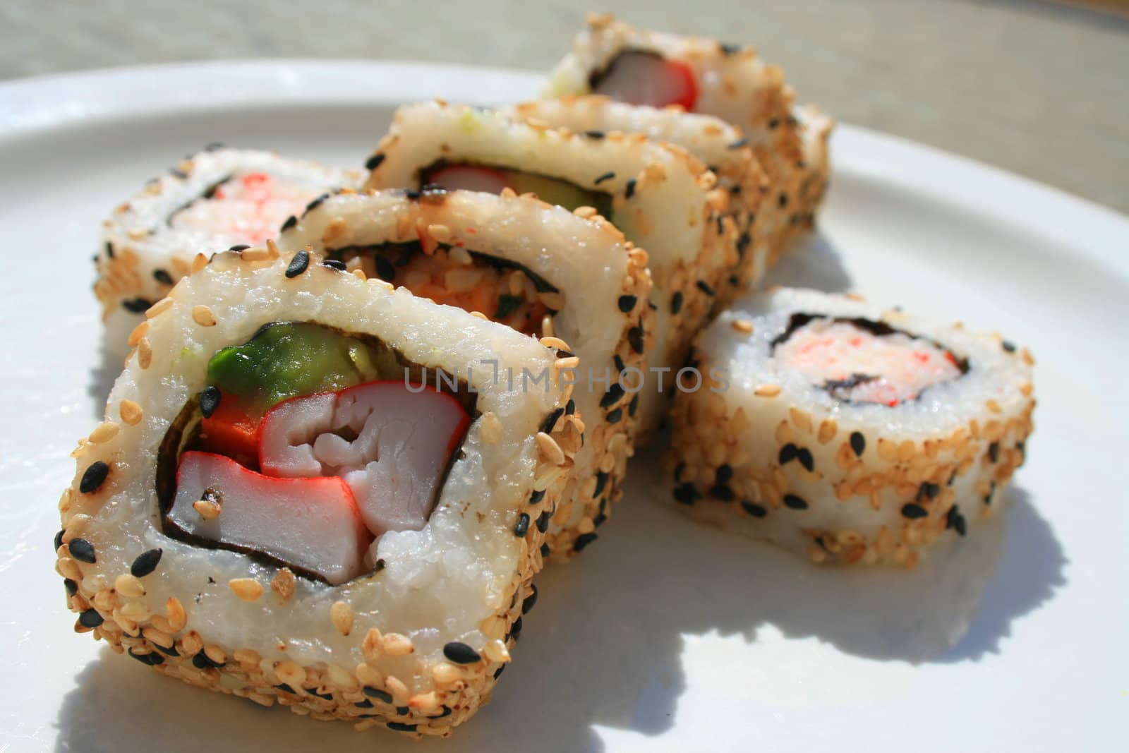 Close up of sushi assortment on a platter.

