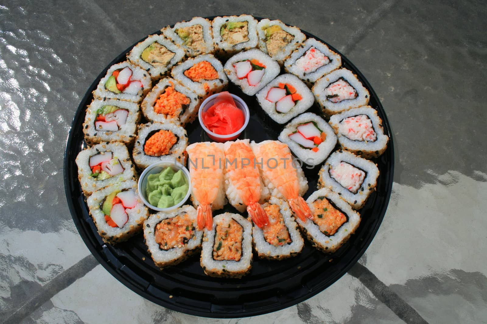 Close up of sushi assortment on a platter.
