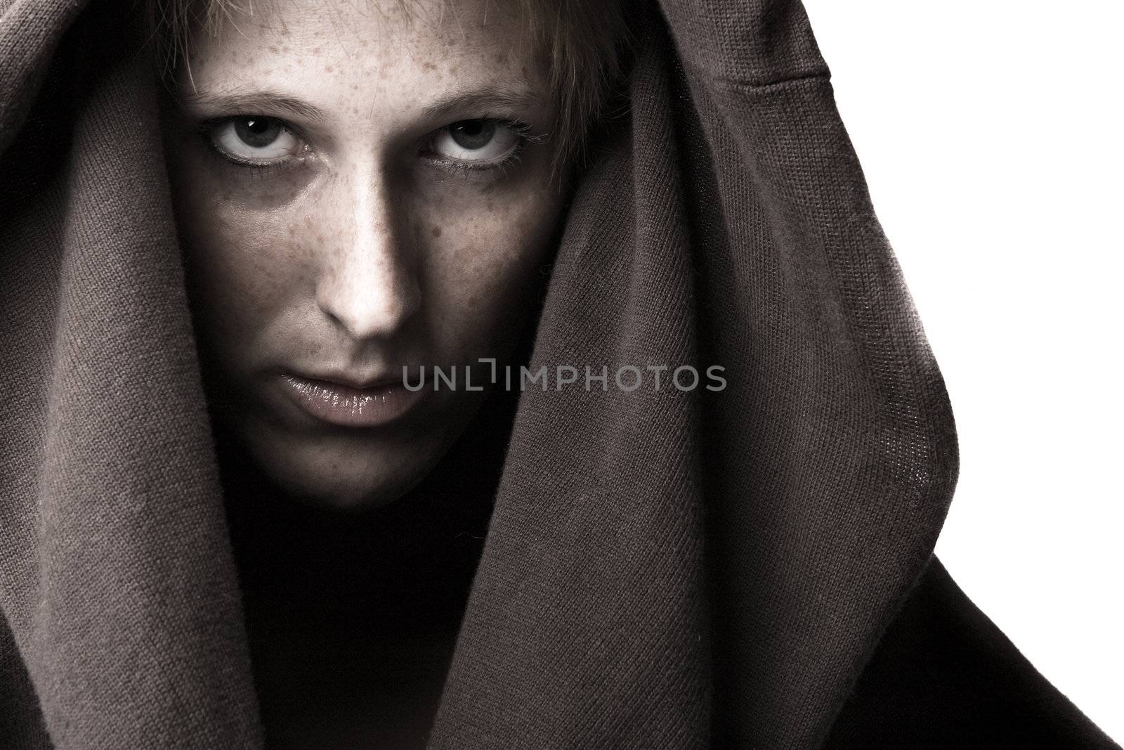 Studio portrait of a cute and beautifull girl in a turtle neck sweater looking daring