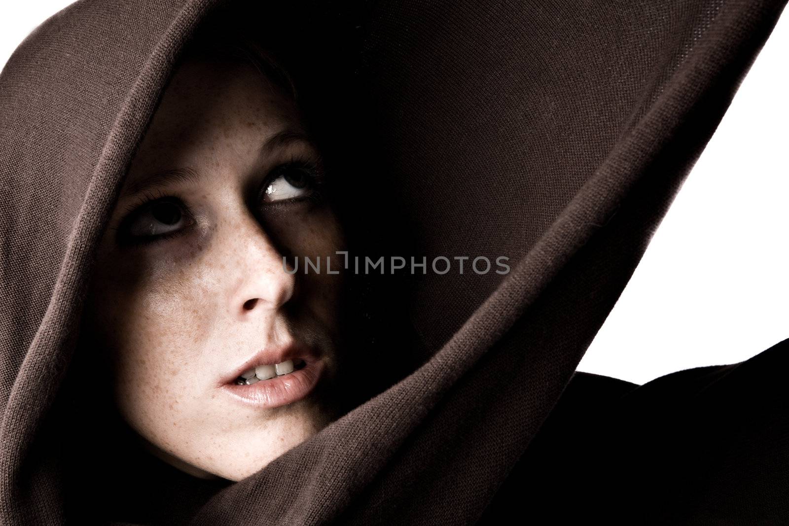 Studio portrait of a cute and beautifull girl in a turtle neck sweater looking up