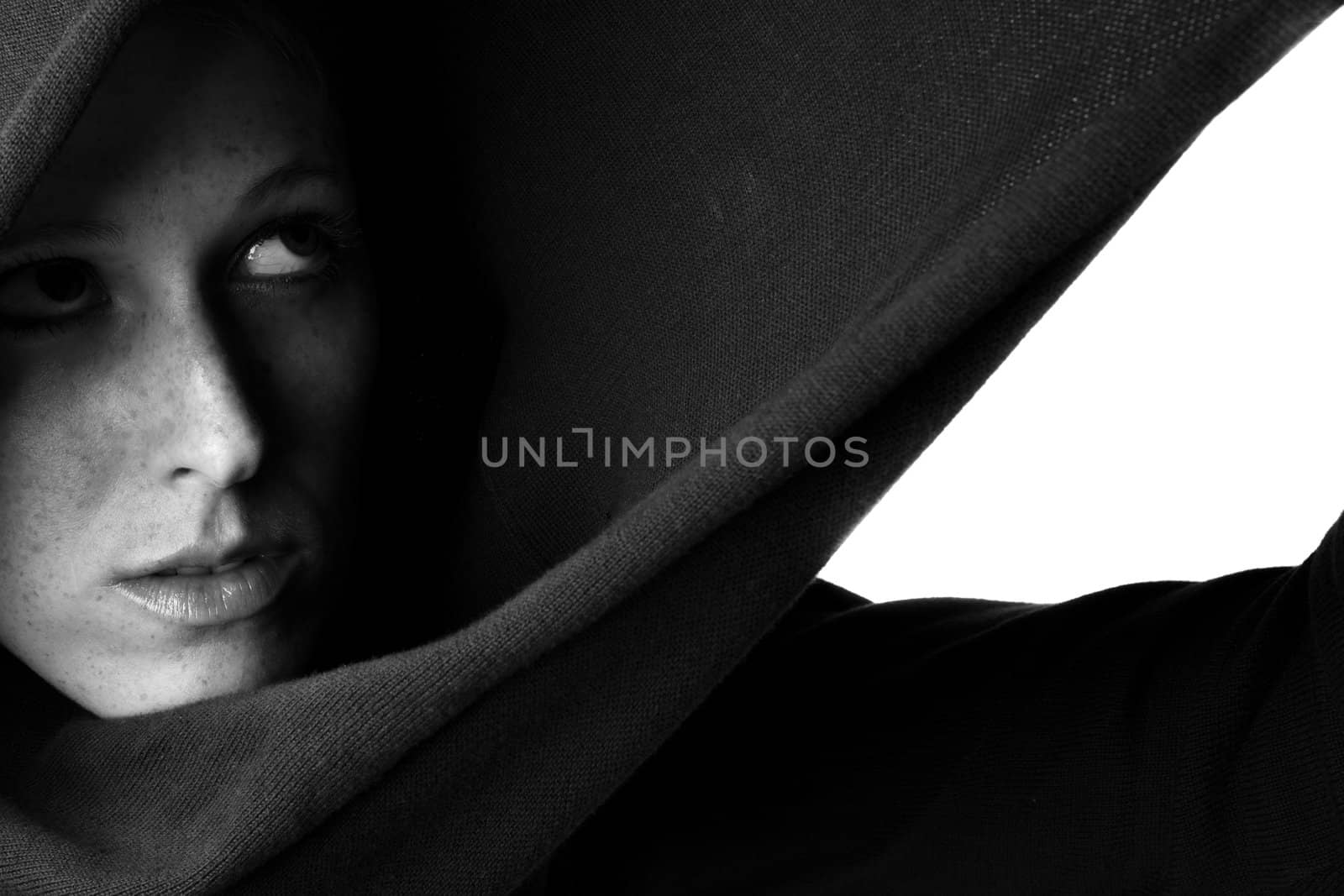 Studio portrait of a beautifull girl in a hooded sweater