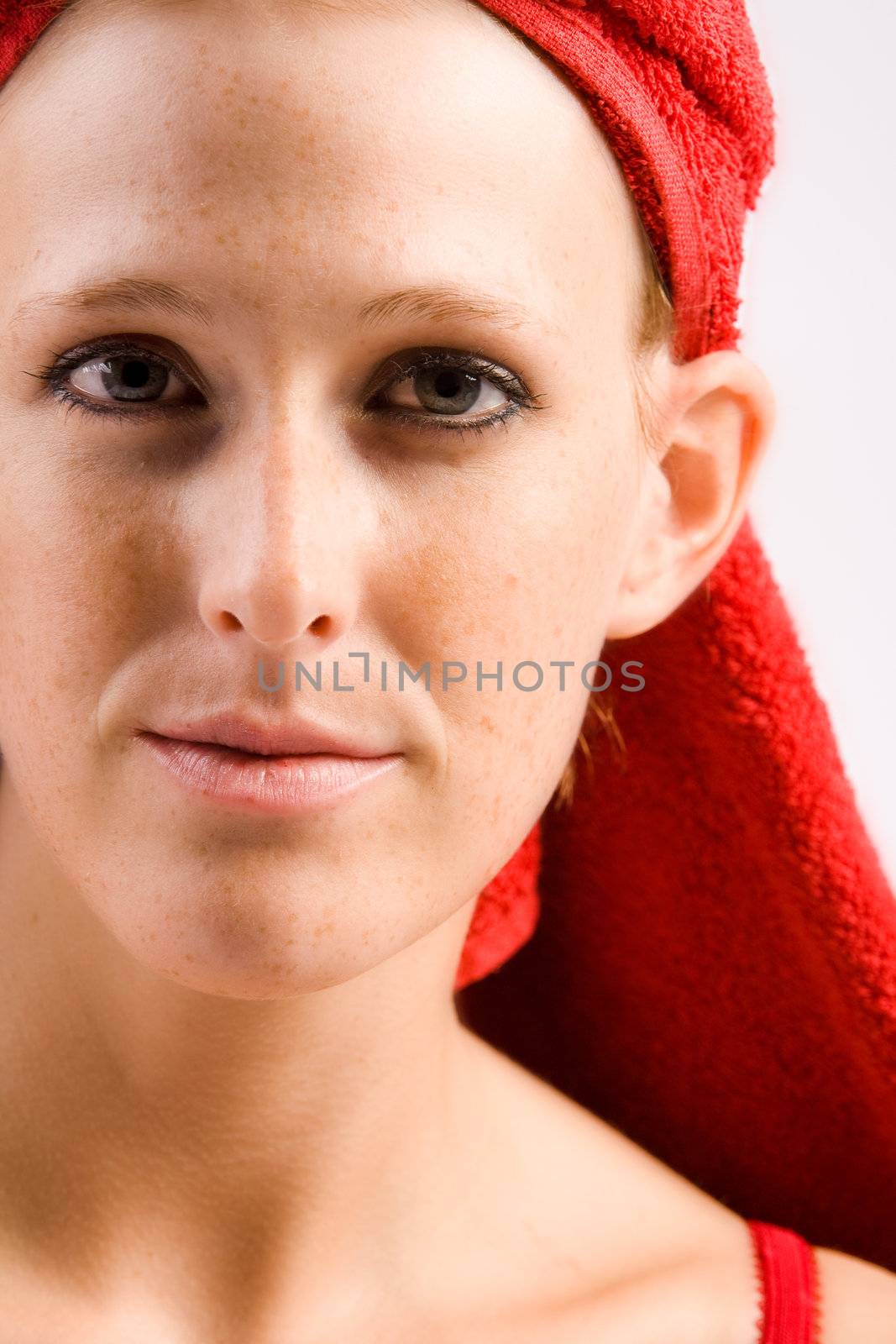 Studio portrait of a beautifull girl with a towel on her head