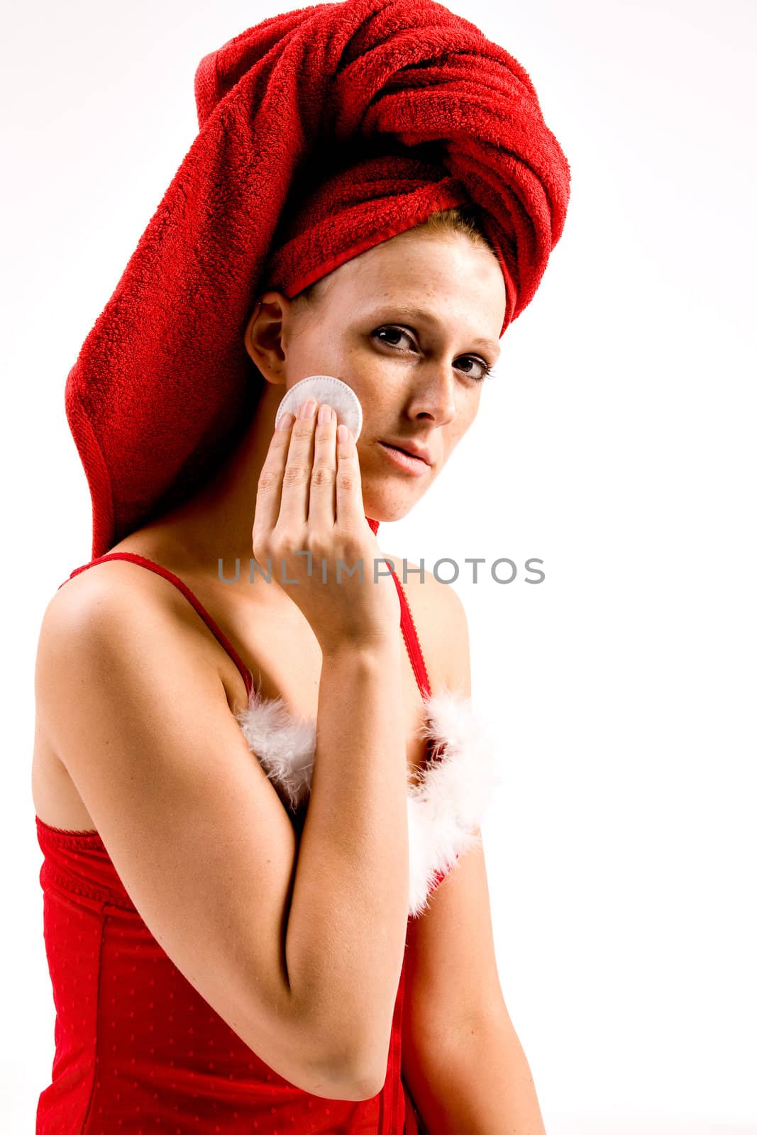 Studio portrait of a beautifull girl who is removing her make-up