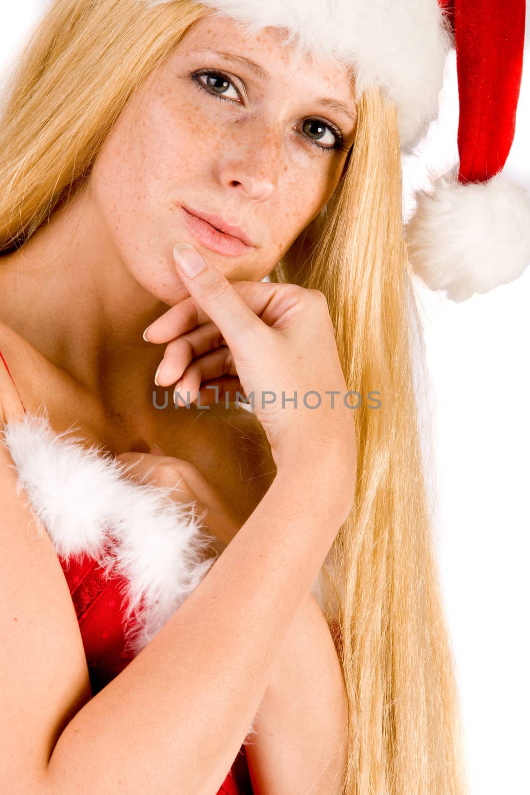 Studio portrait of blond christmas girl with very long blond hair thinking
