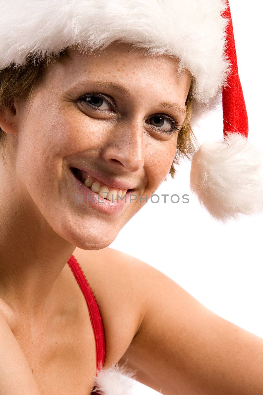 Studio portrait of blond christmas girl smiling at you