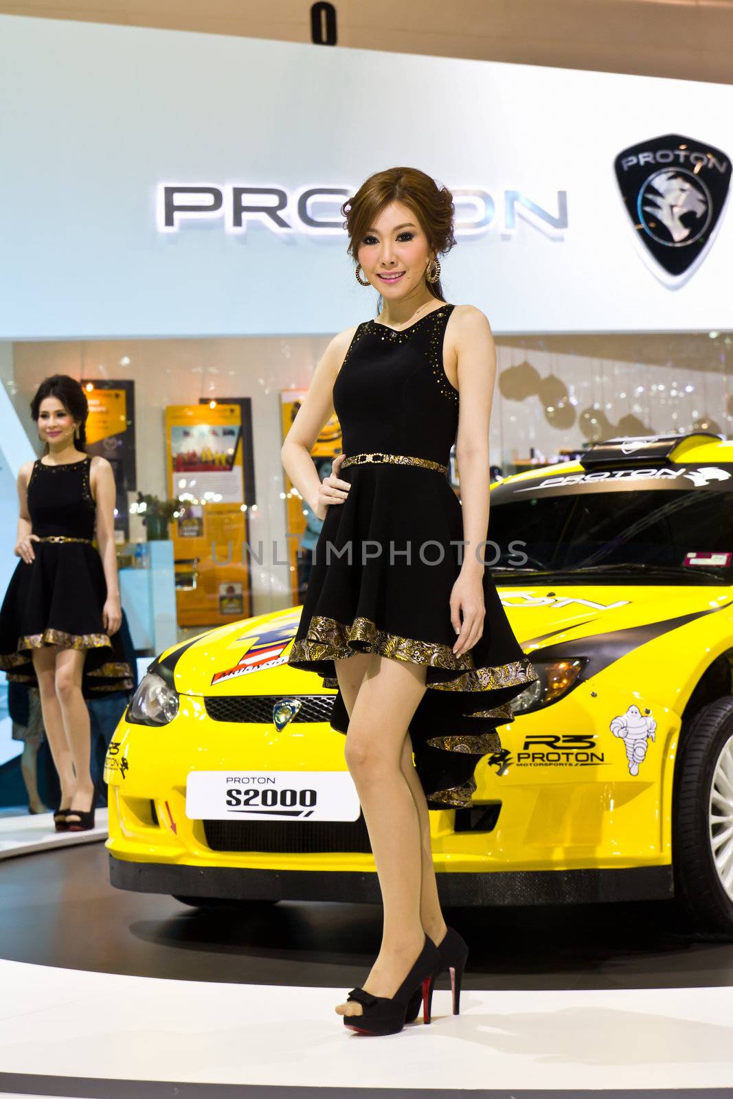 NONTHABURI,THAILAND - DECEMBER 3,2011: Unidentified female presenter at booth  Thailand International Motor Expo 2011 on December 3, 2011 in Nonthaburi, Thailand.