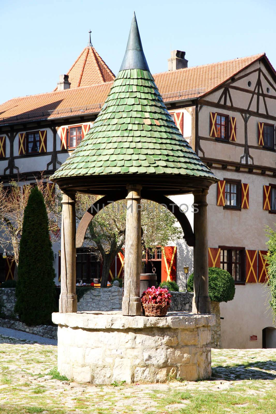 A fountain in the Castle Harburg in Bavaria, Germany, Europe.