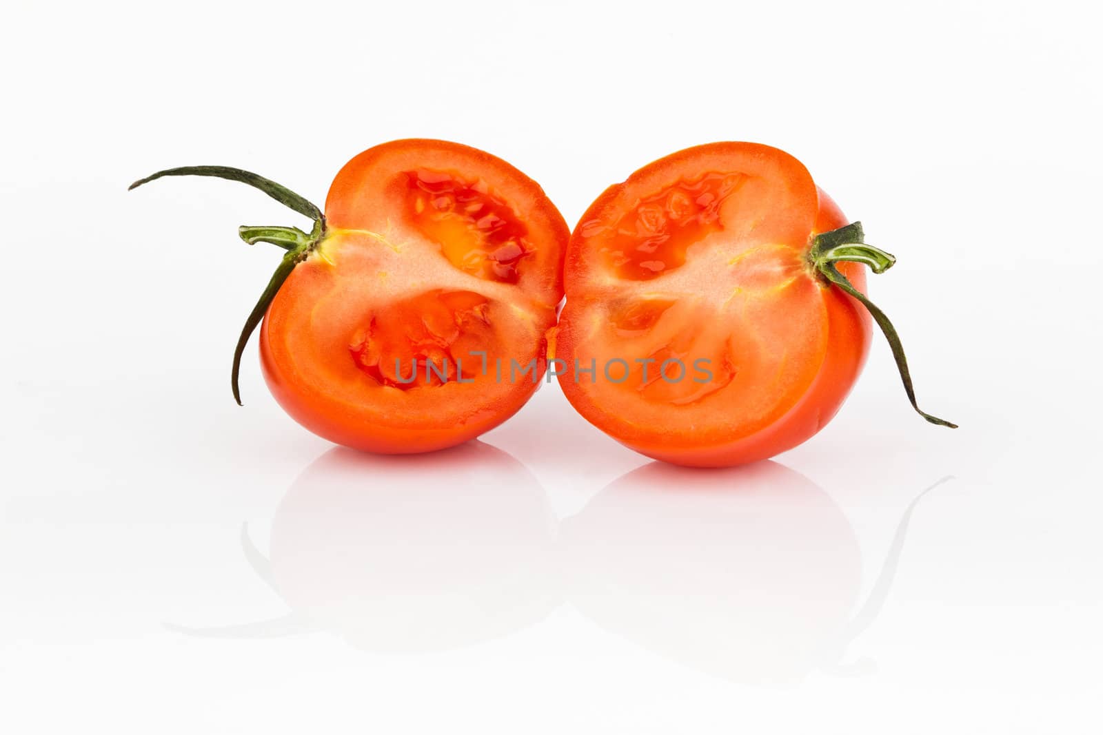 fresh tomato with shadow isolated on white.