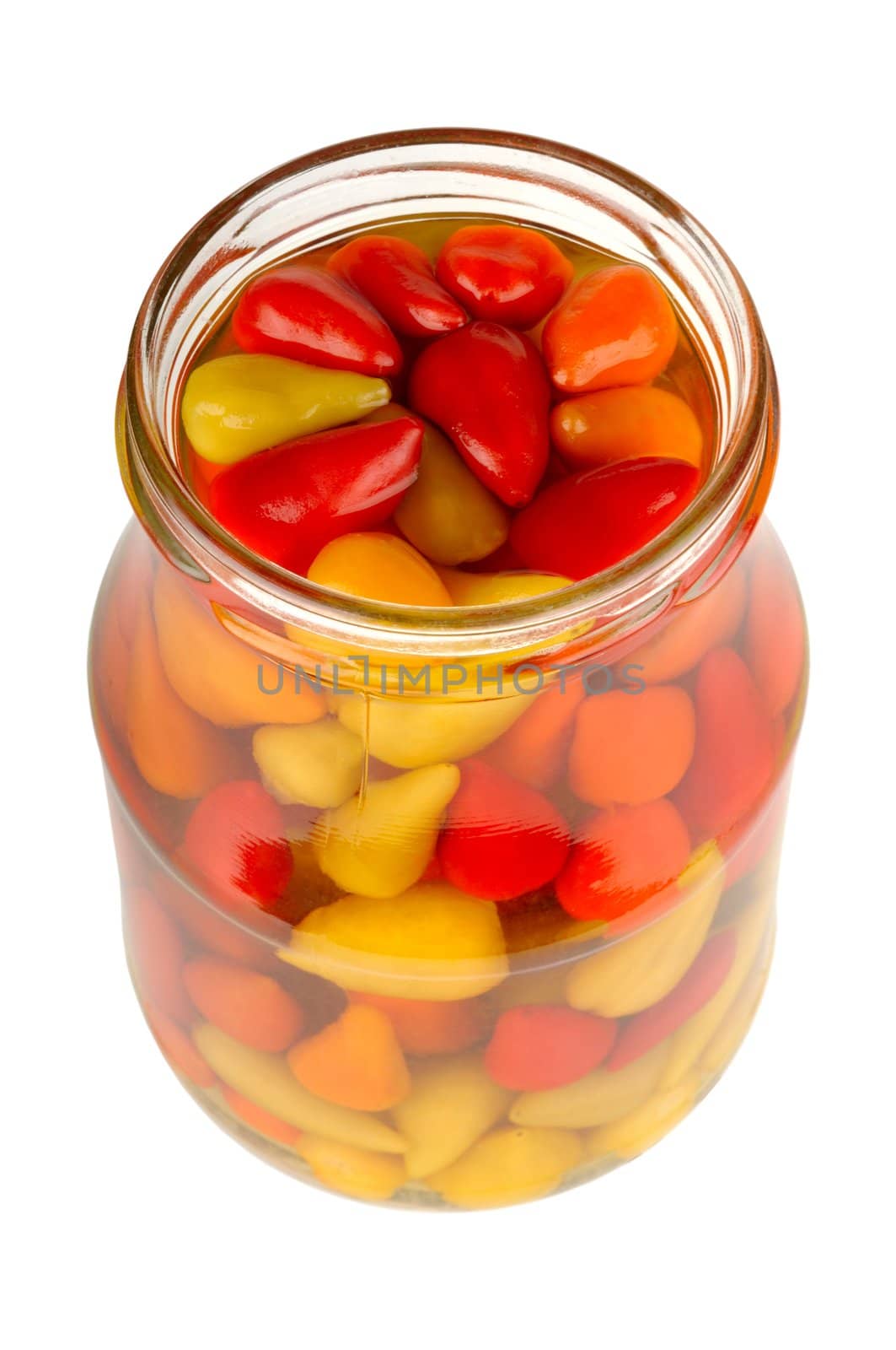 canned peppers in a glass jar isolated on white background