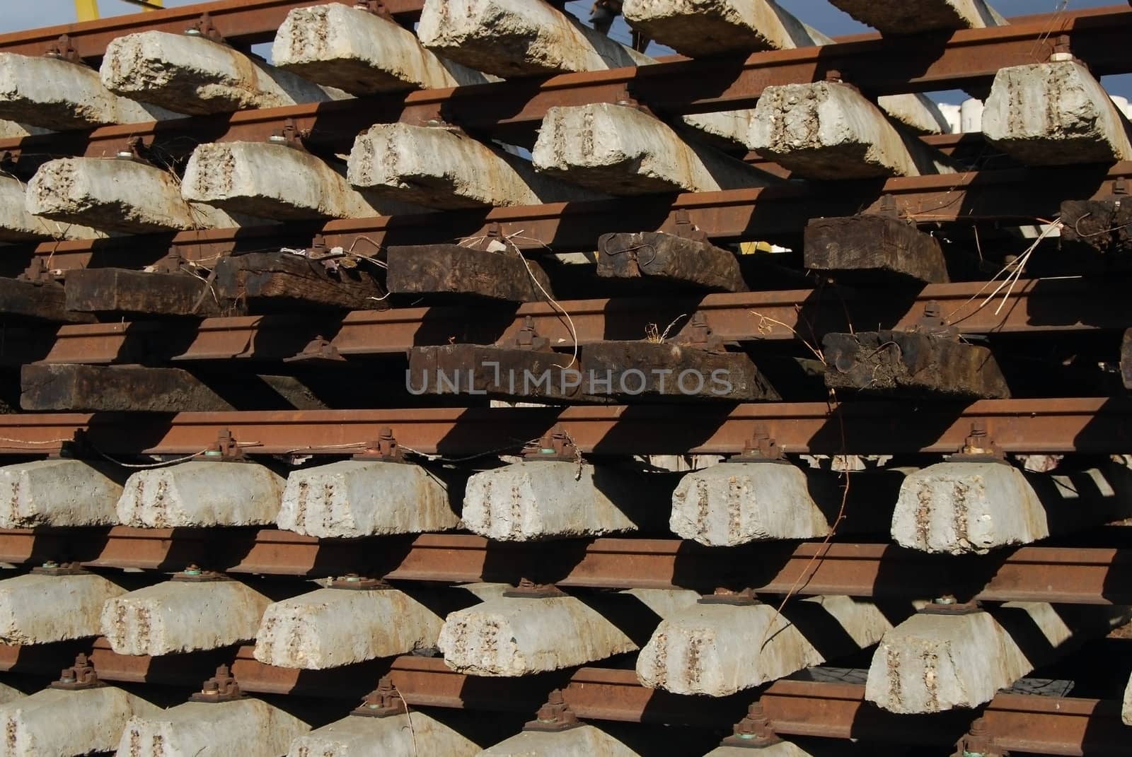 Rows of ferro-concrete and wood cross-ties and steel rails