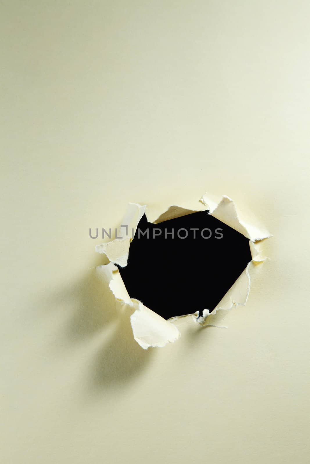 stock image light though a hole on the paper