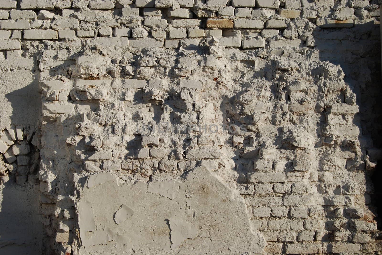 Jagged white painted brick wall as background