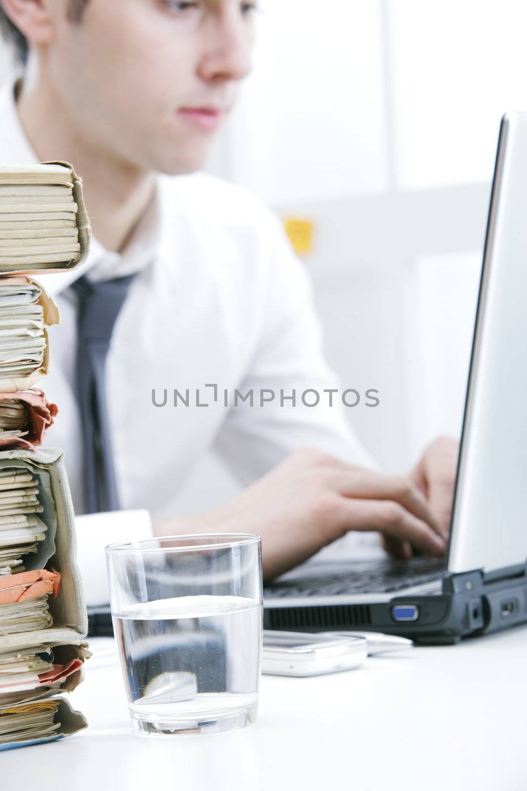 Young businessman at desk in his office