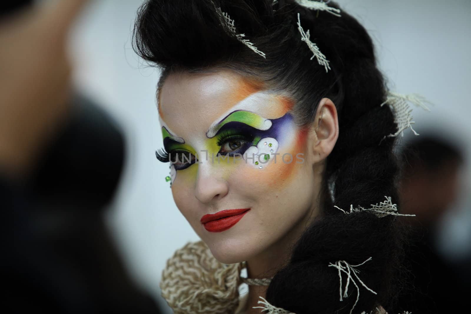 Portrait of young woman with bright makeup.