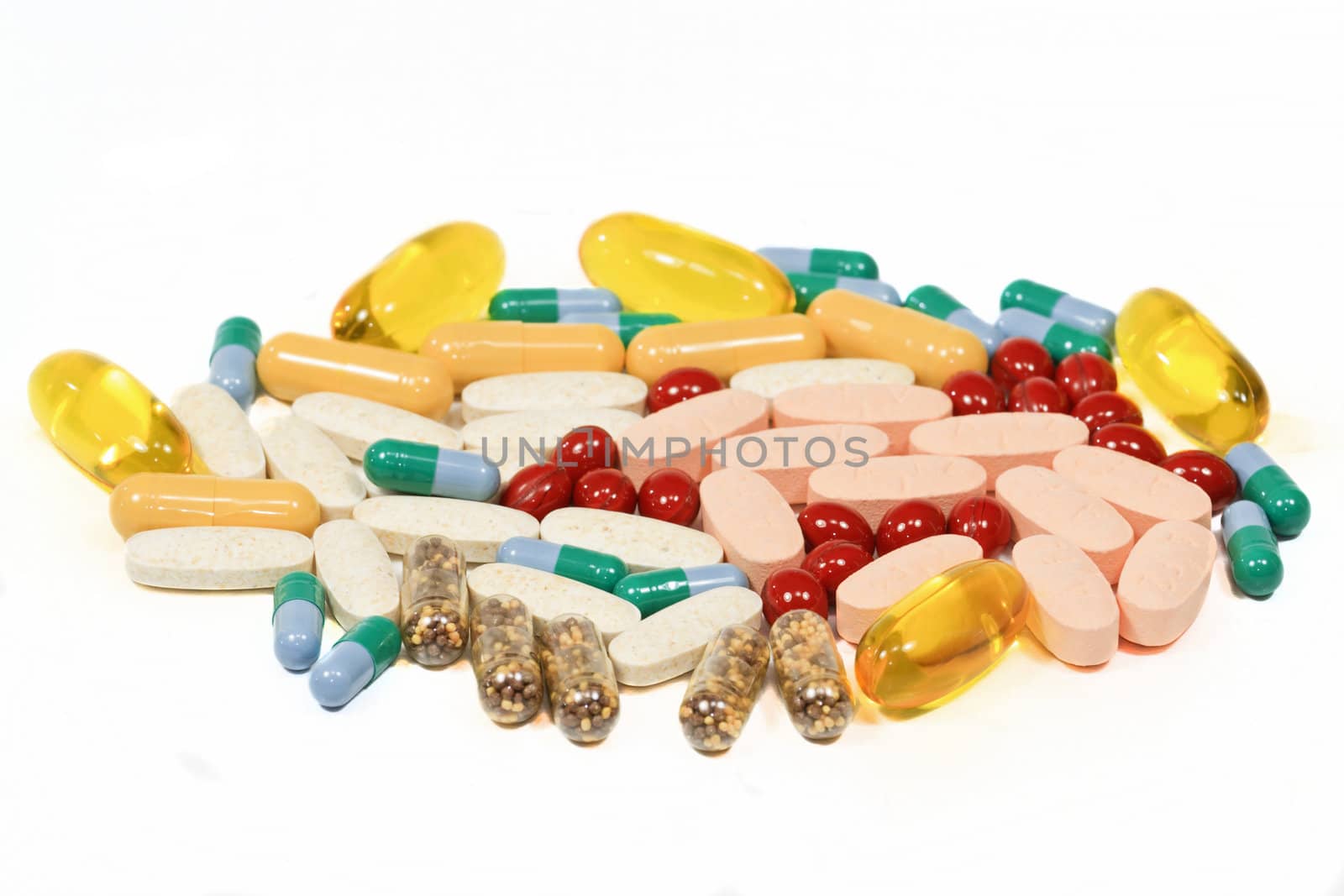 Vitamins, pills and tablets isolated on white background