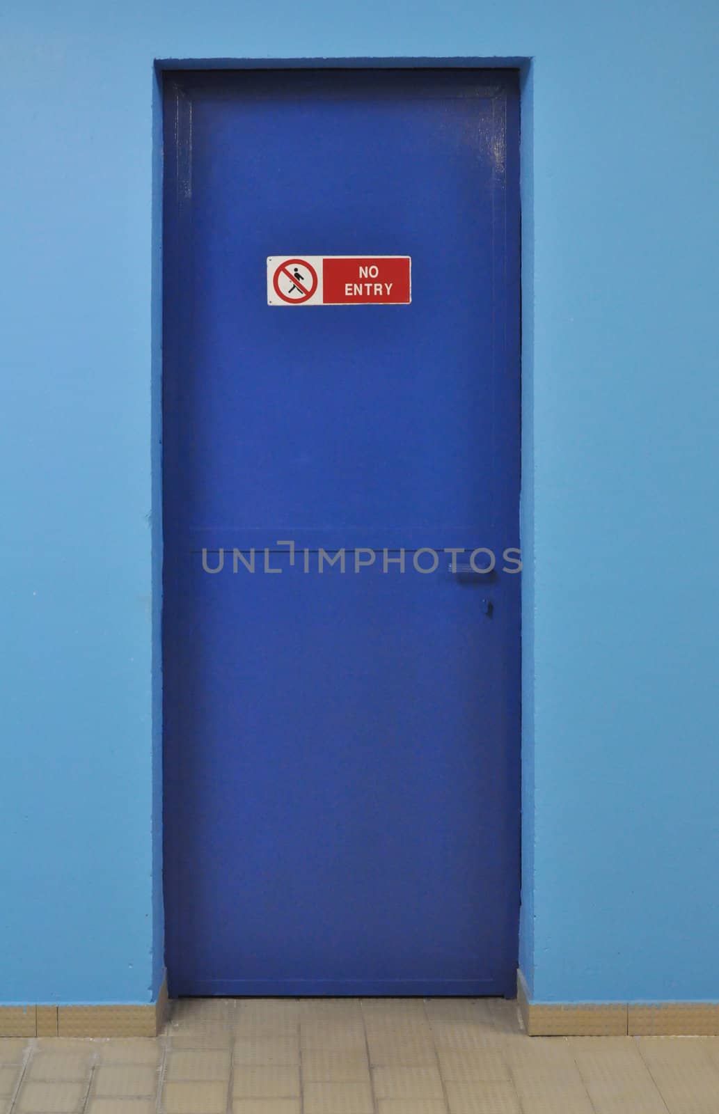 No entry sign on a blue firewall door