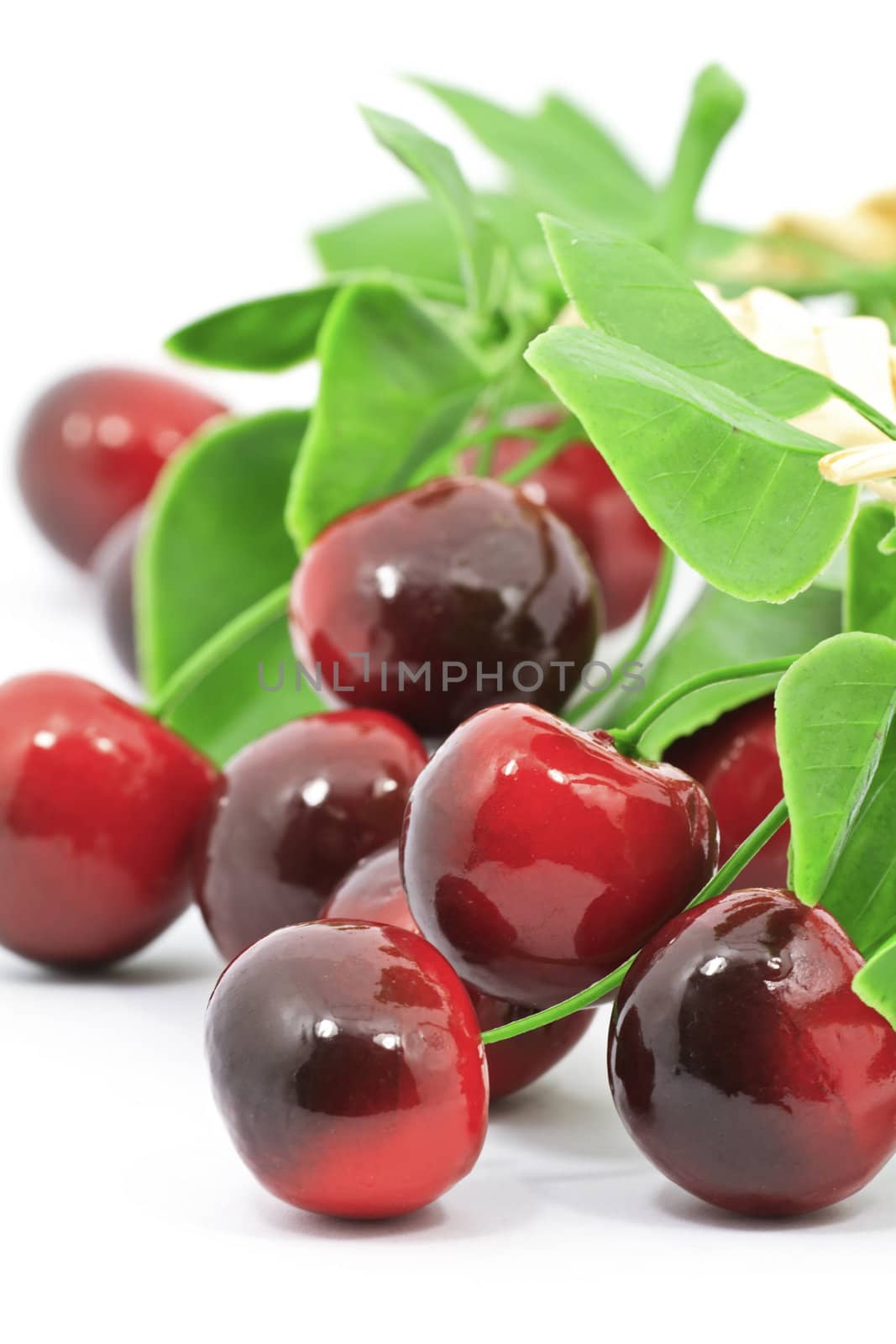 Sweet red cherries with leaves isolated on wite background