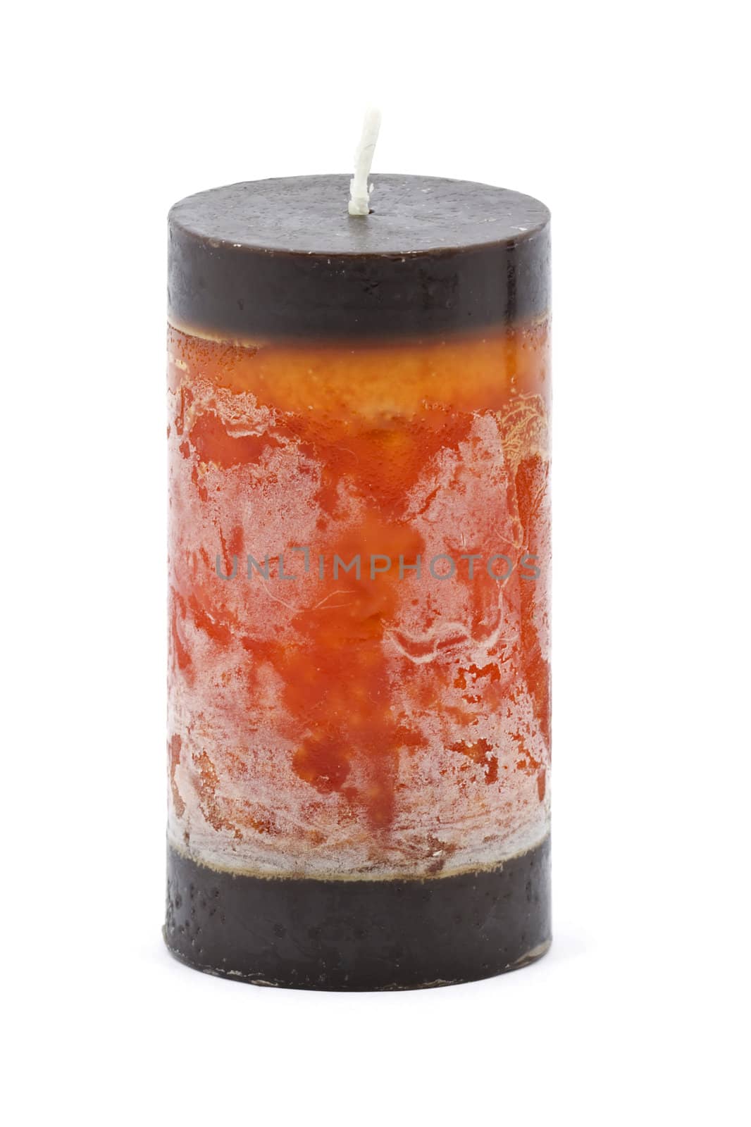 Multicolored candle with brown top and bottom isolated on white background