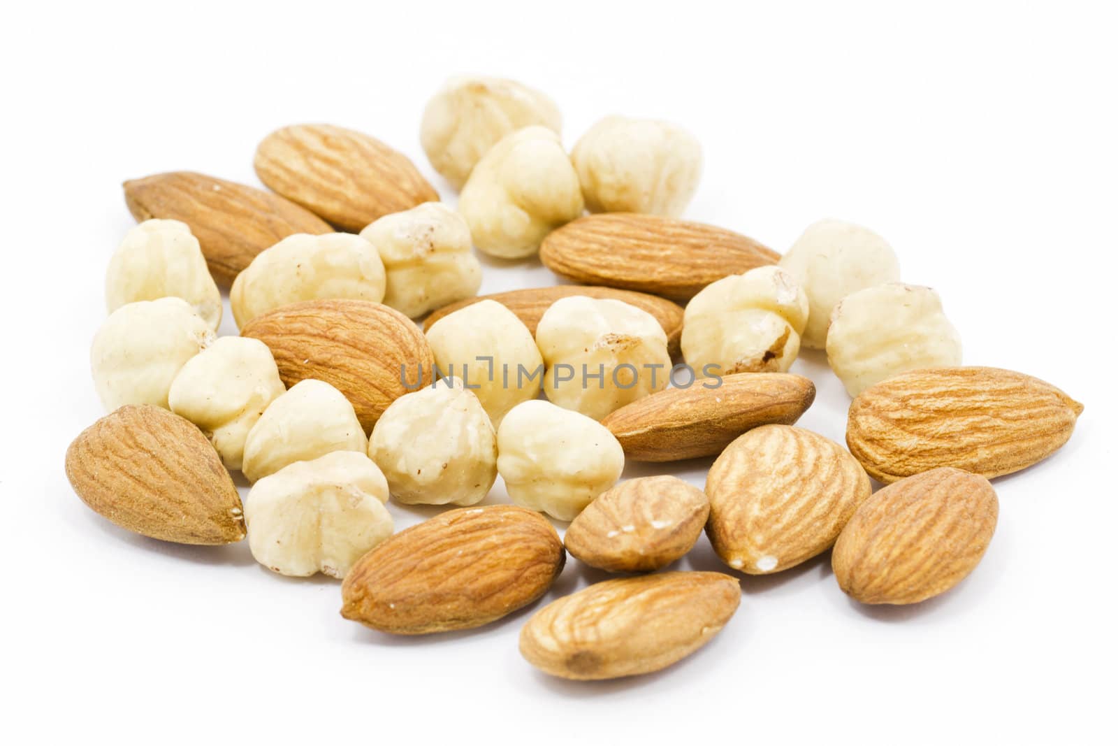 Mixed nuts closeup view on white background