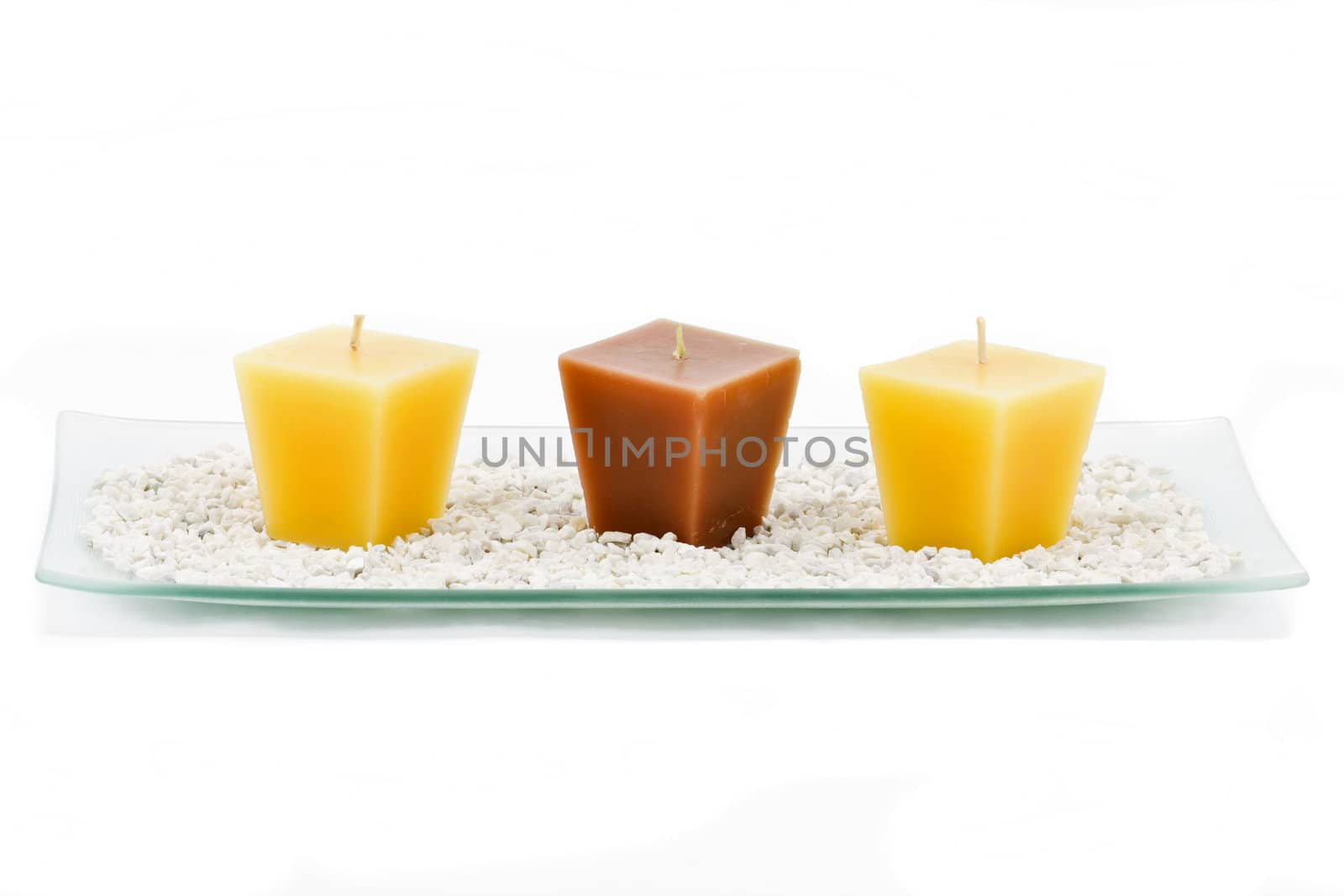 Three colored candles decoration isolated on white background