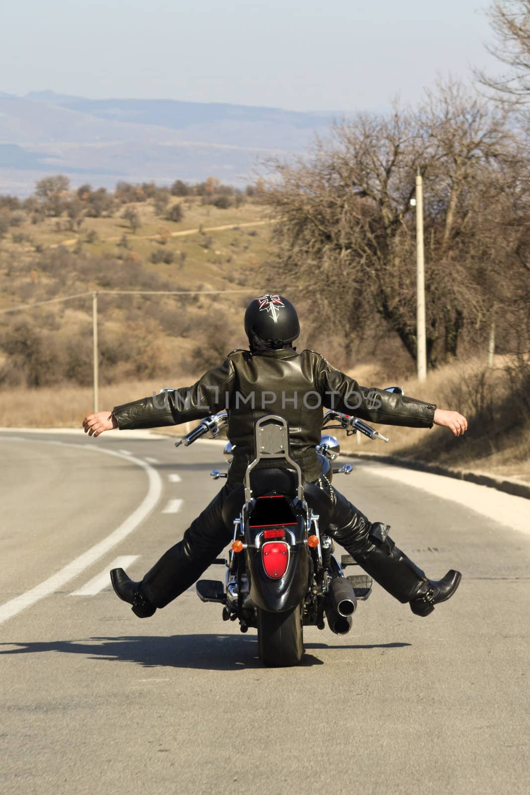 Biker stretching on the bike during a long day ride